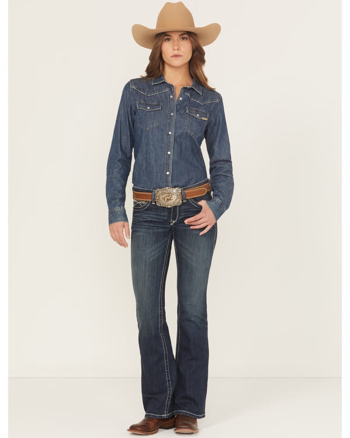 Dark wash bootcut jeans with a denim shirt and ornate belt — Concert Bootcut Jeans Outfits 2027