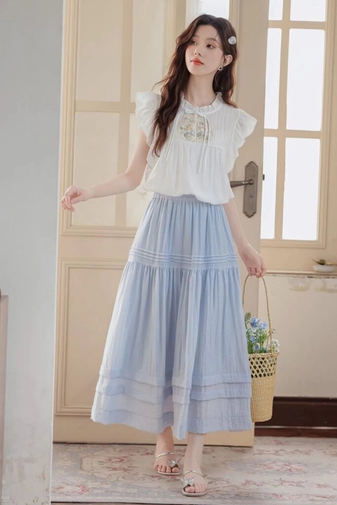 White ruffled blouse with light blue tiered skirt — Coquette Spring Outfits 2027