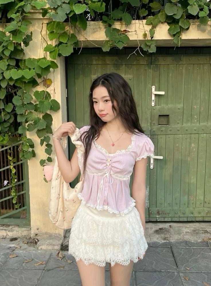Pink lace tie-front top with white tiered skirt — Coquette Spring Outfits 2027