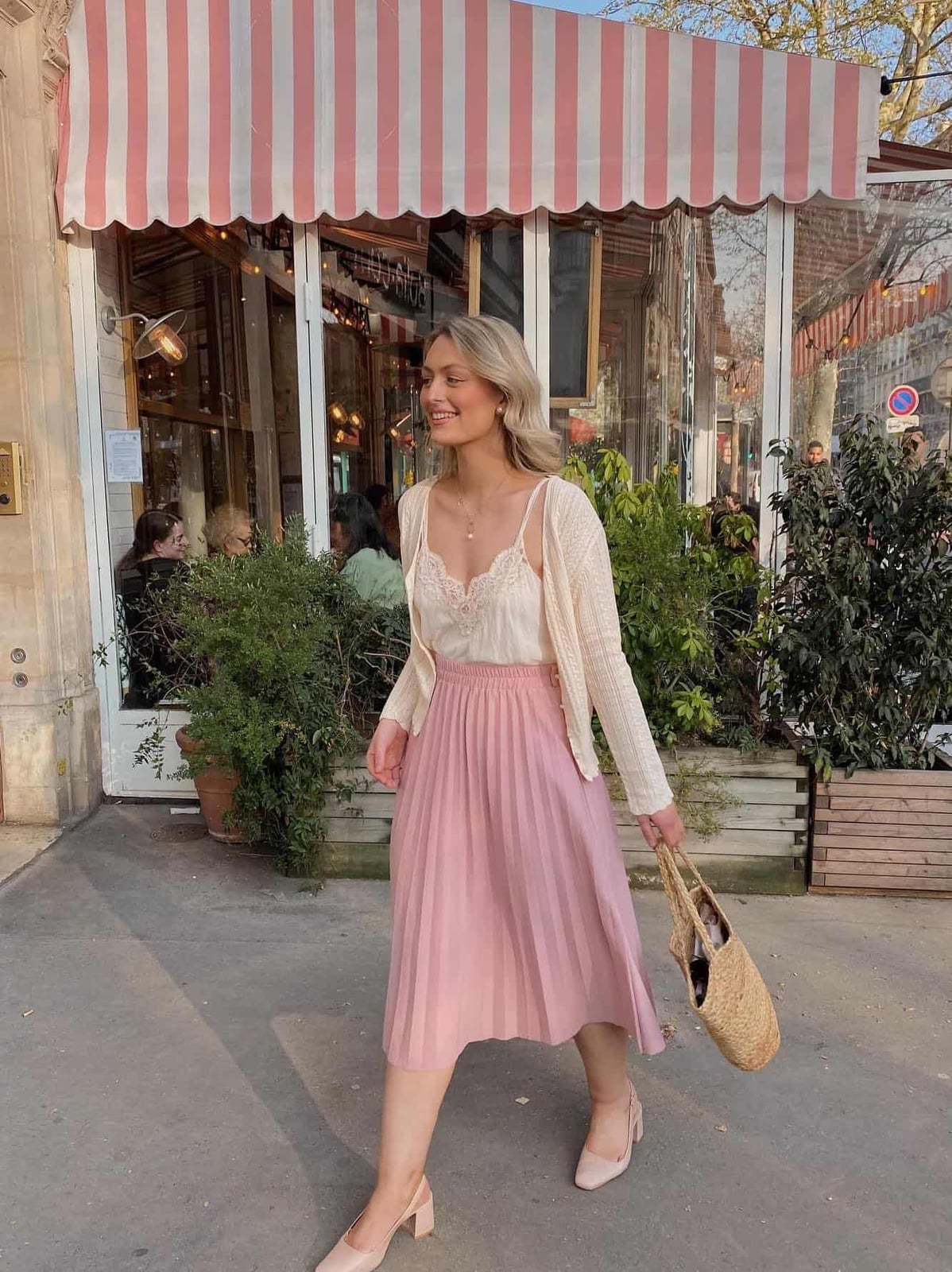 Cream cardigan over lace camisole and pink pleated skirt — Coquette Spring Outfits 2027