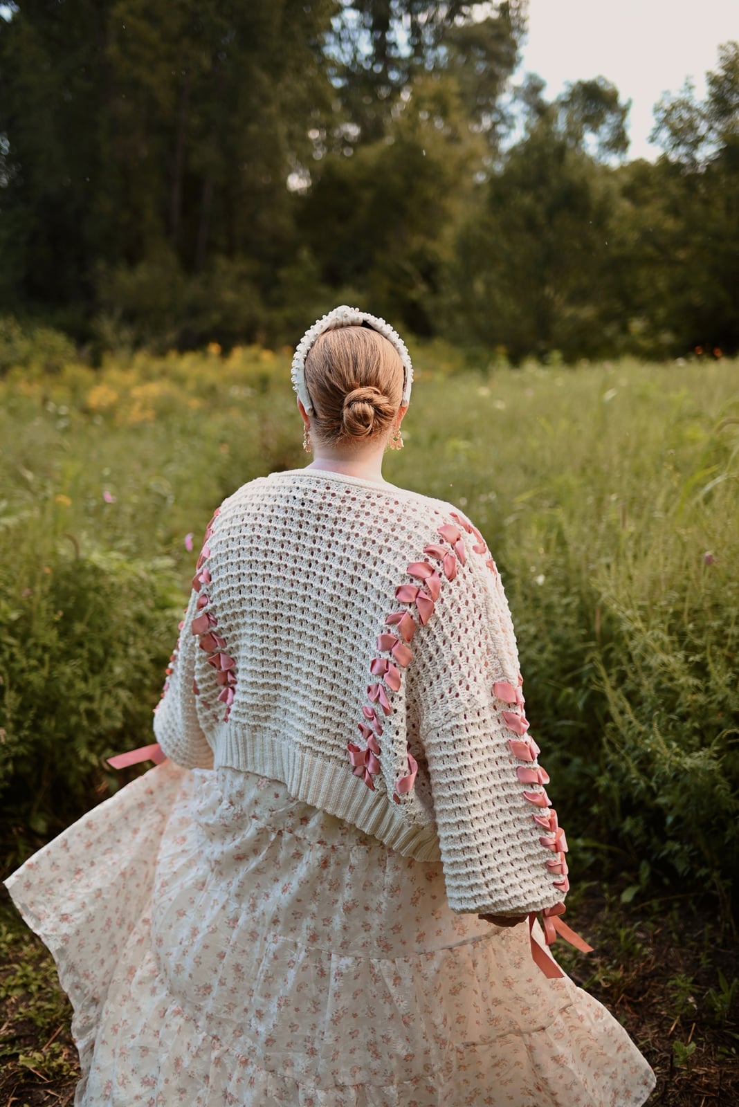 Cream chunky knit cardigan over floral dress — Coquette Spring Outfits 2027