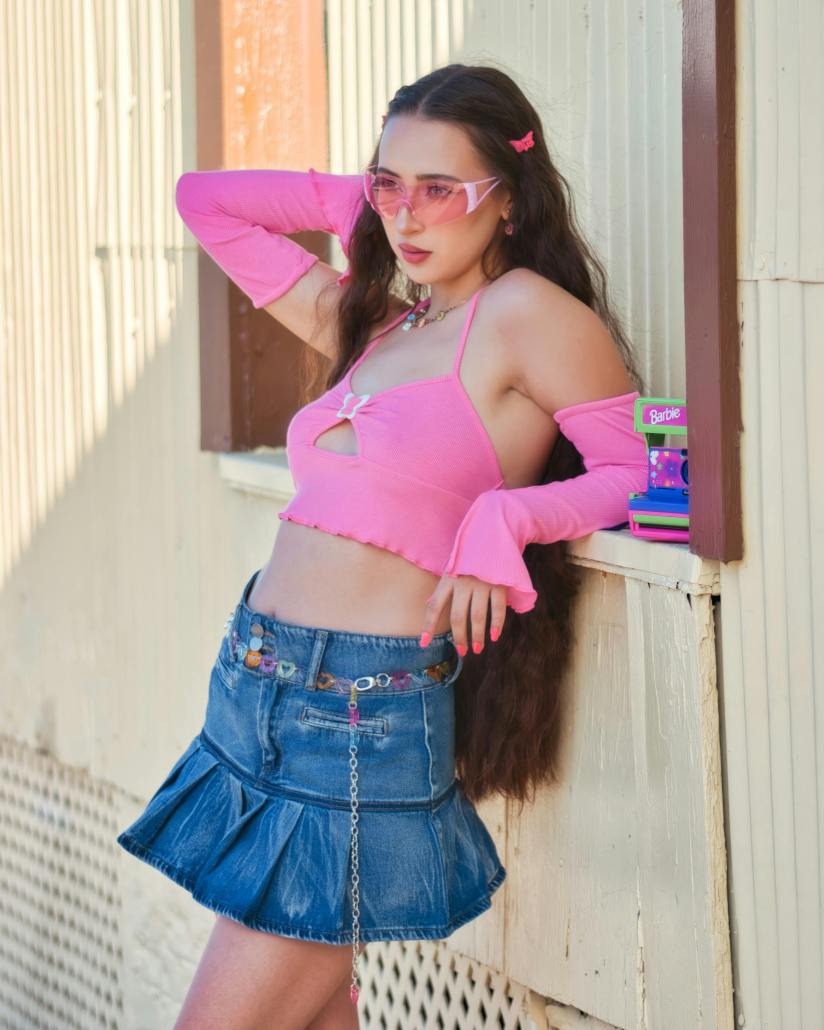 Pink halter top with arm warmers and denim mini skirt Pink halter top with arm warmers and denim mini skirt — Cyber Y2K Outfits 2027