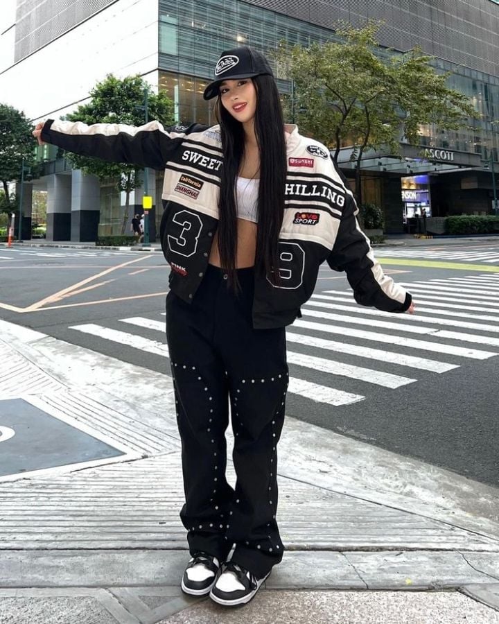 Racing jacket with patches over tank top and baggy pants Racing jacket with patches over tank top and baggy pants — Cyber Y2K Outfits 2027
