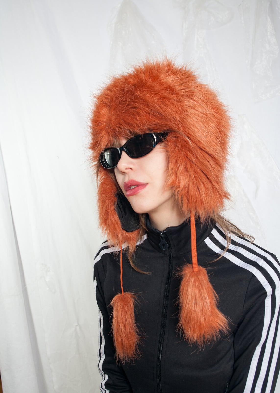 Oversized orange faux fur hat with track jacket Oversized orange faux fur hat with track jacket — Cyber Y2K Outfits 2027