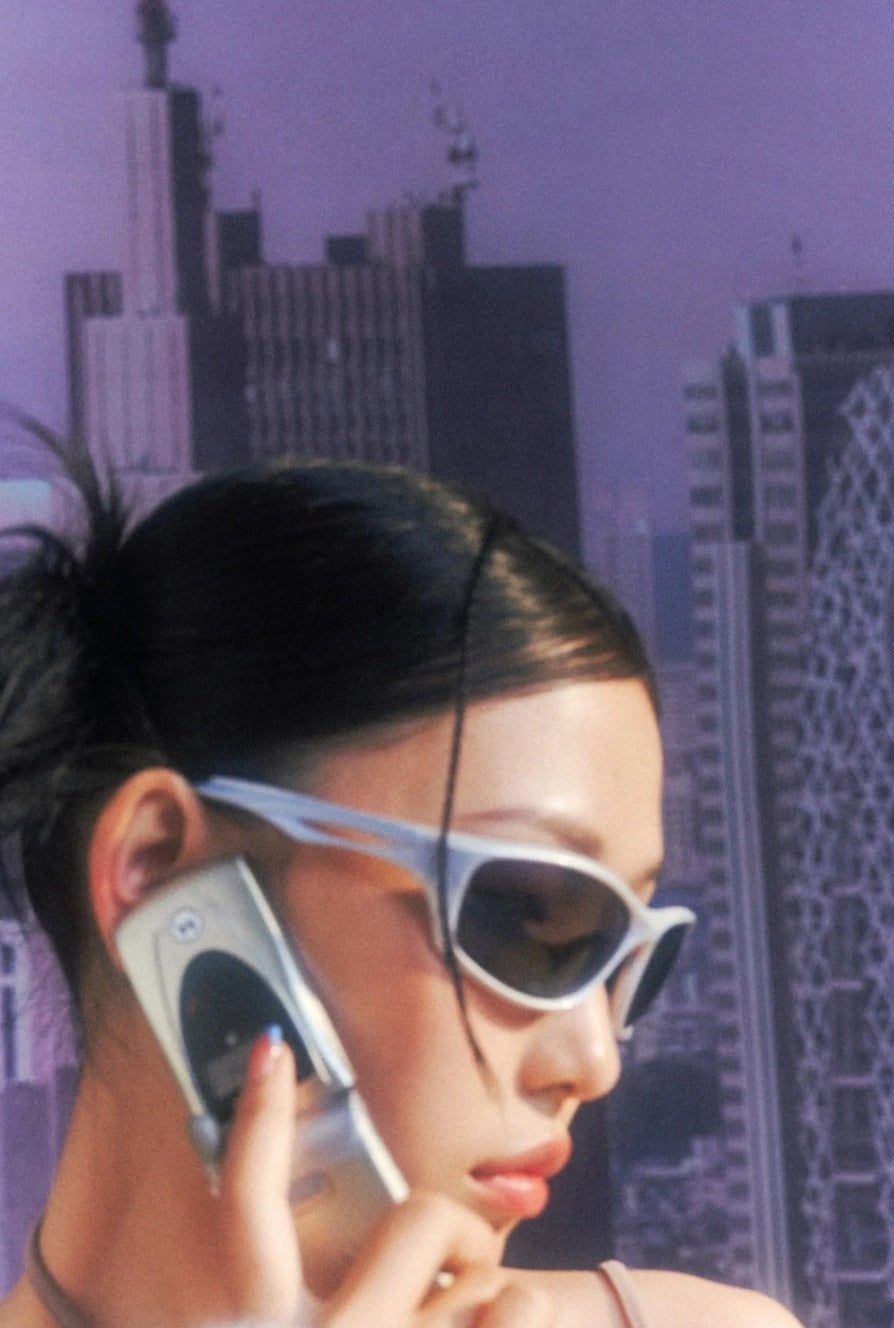 Futuristic wrap-around sunglasses and flip phone Futuristic wrap-around sunglasses and flip phone — Cyber Y2K Outfits 2027