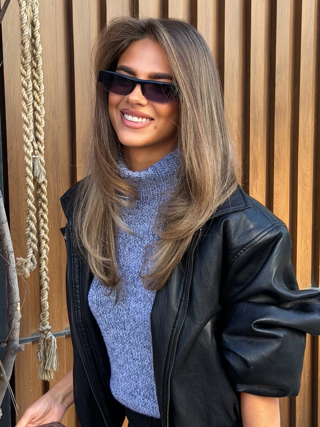 Elongated Face Framing Creates a Narrower Shape Light brown hair with elongated face-framing layers and outward ends