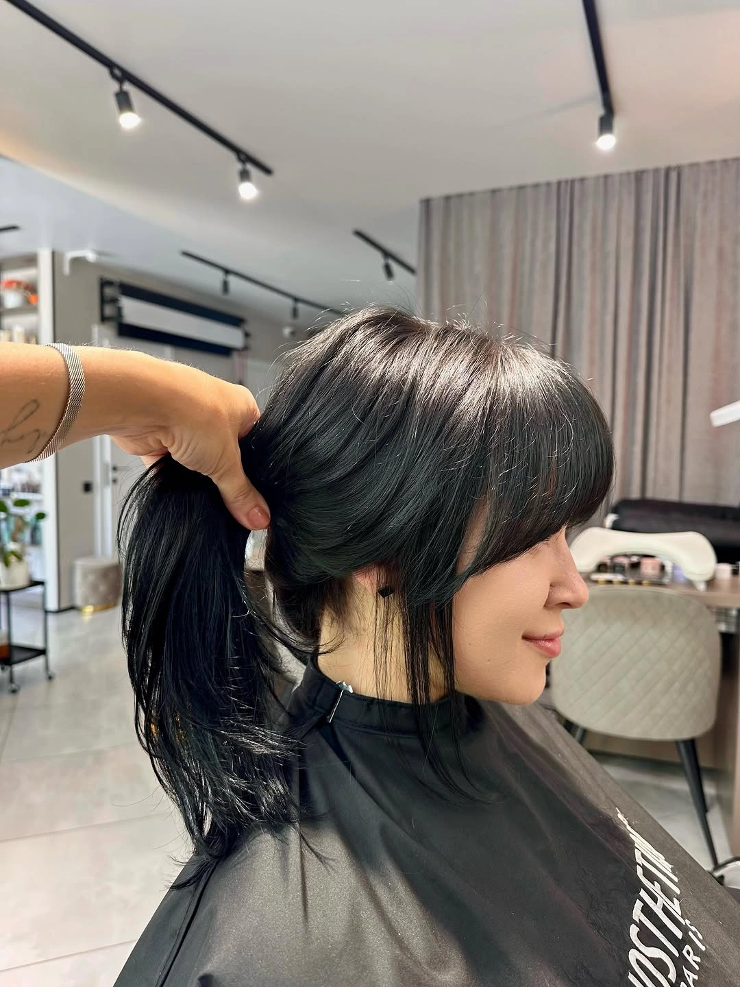 Long Front Pieces Stay Visible When Hair Is Up Dark gathered hair with long fringe and face-framing pieces