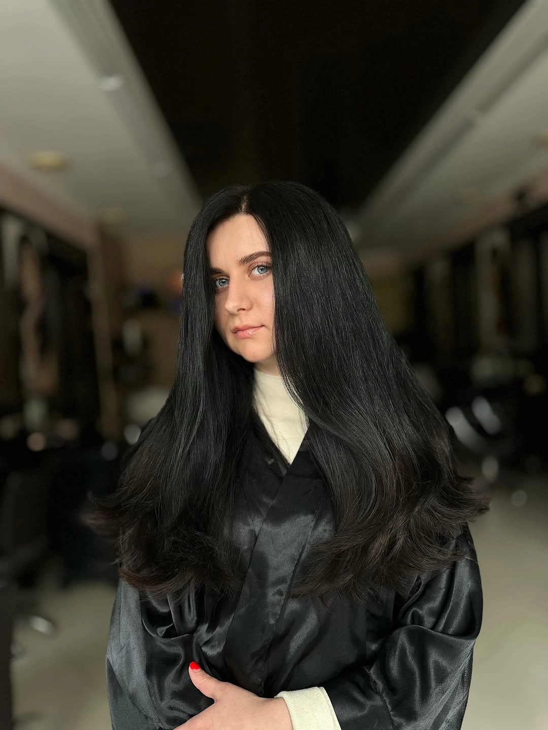 Very Long Layers With Fullness Placed Low Very long black hair with center part and broad lower layers