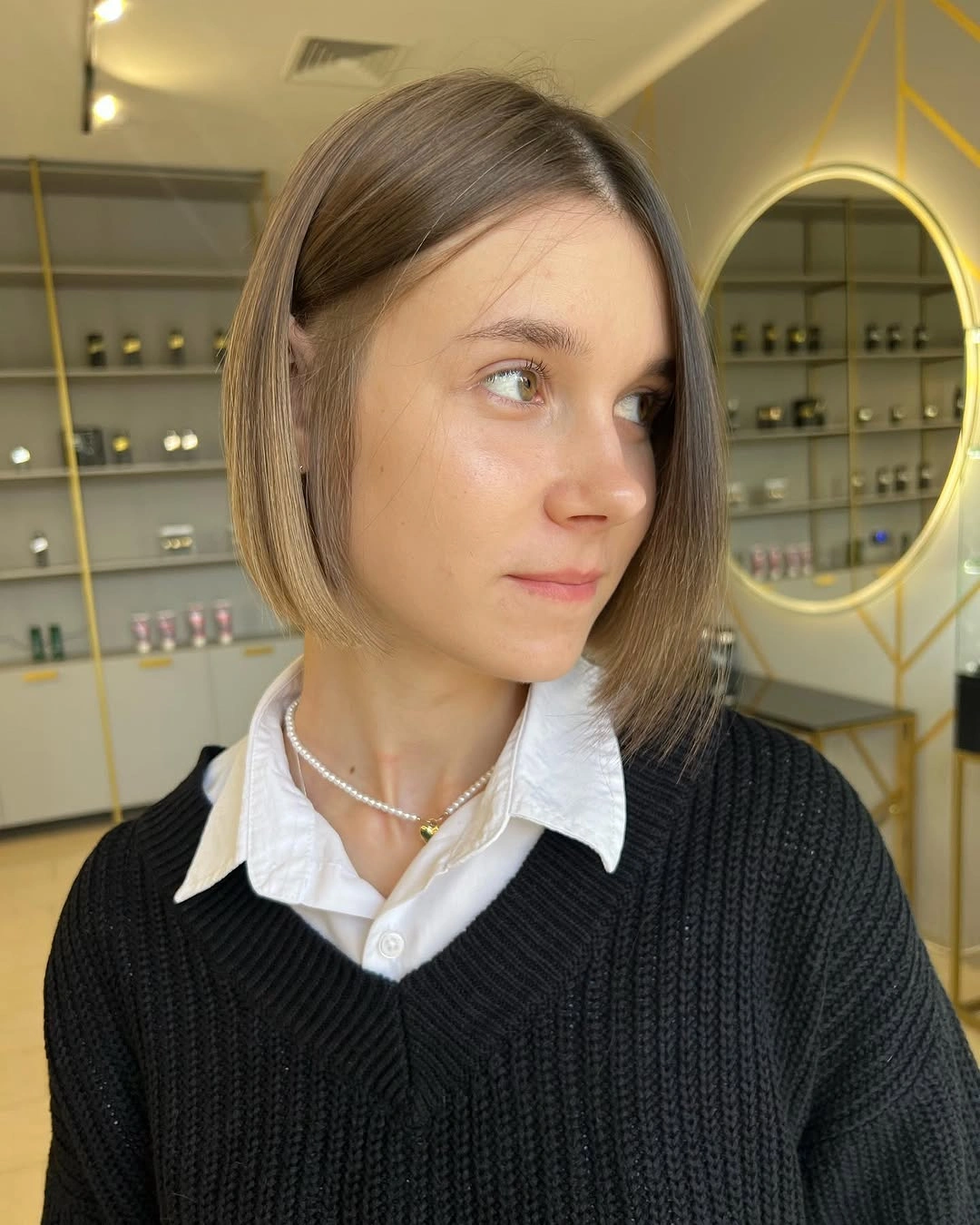 A Quiet Bob Built on Clean Proportion Short light-brown bob with side part and one side tucked