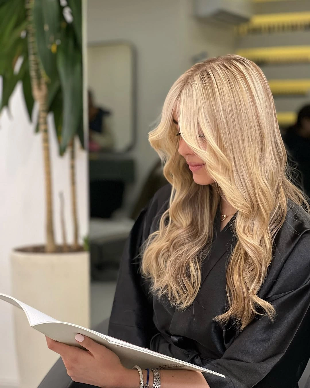 Long Blonde Layers That Keep Their Length Long blonde hair with broad face-framing layers and loose bends