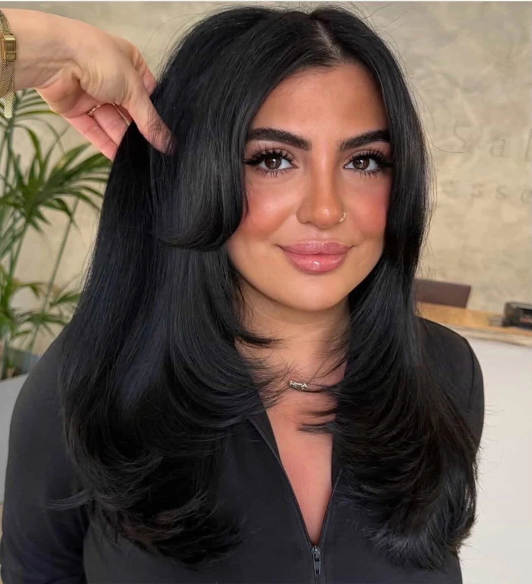 Full Long Layers Build Shape Around the Face Long black hair with center part and rounded face-framing layers
