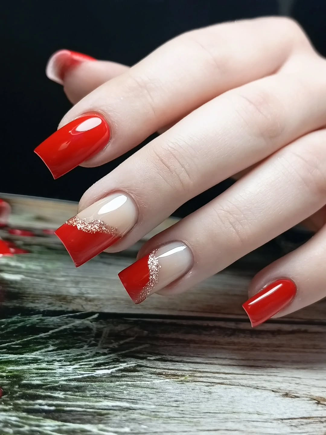 Red Negative-Space Nails With Champagne Glitter Curves Long square red nails with nude sections and glitter arcs