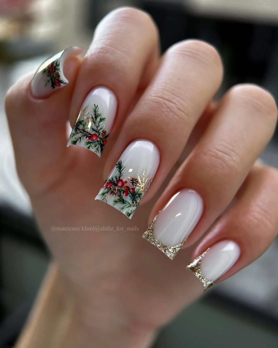 White Botanical Tips With Gold-Toned Sparkle White square nails with evergreen-style tips and gold-toned borders