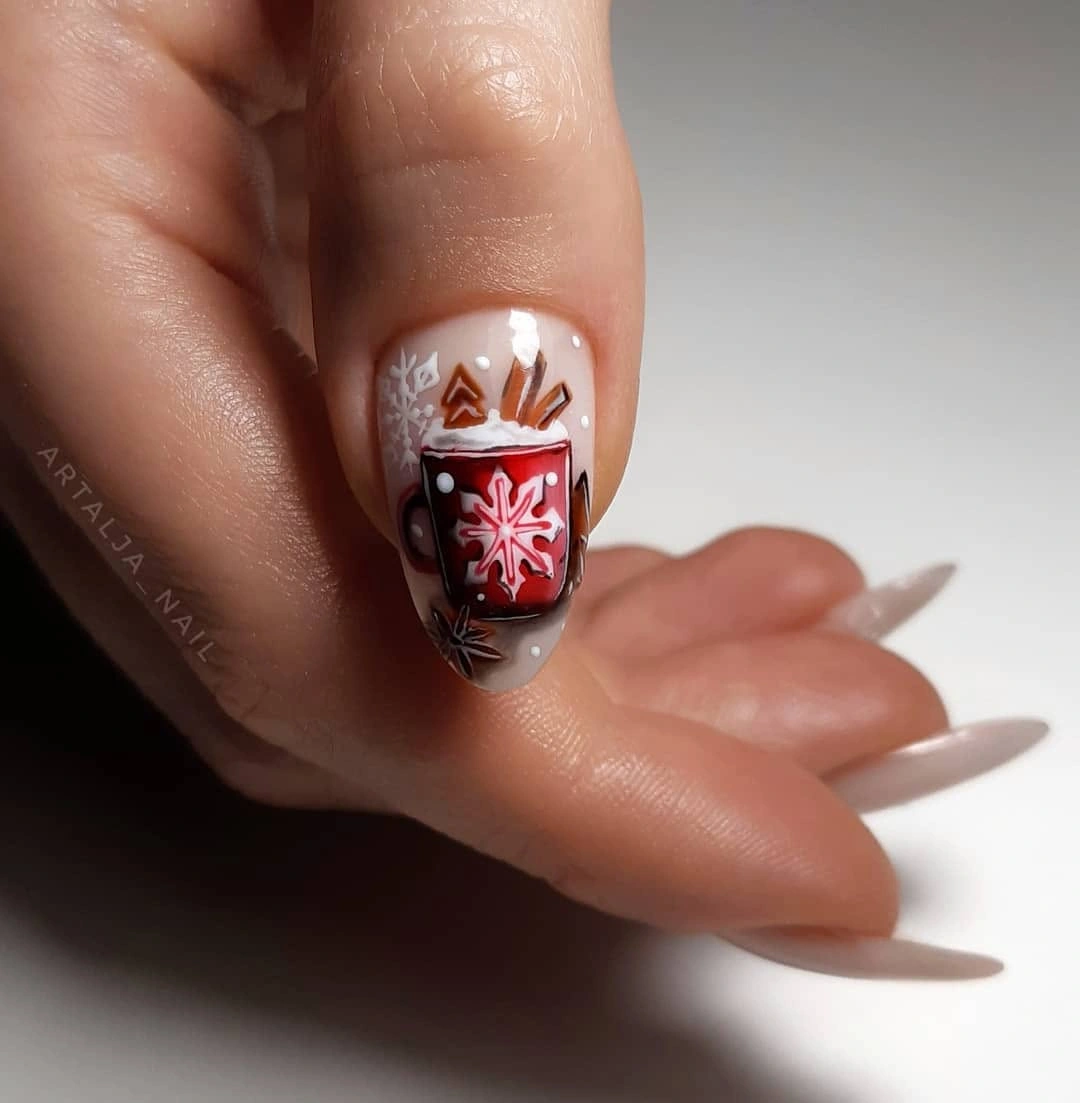 A Cozy Red Mug Accent for December Neutral almond nail with red mug, snowflake, and bronze-gold winter details