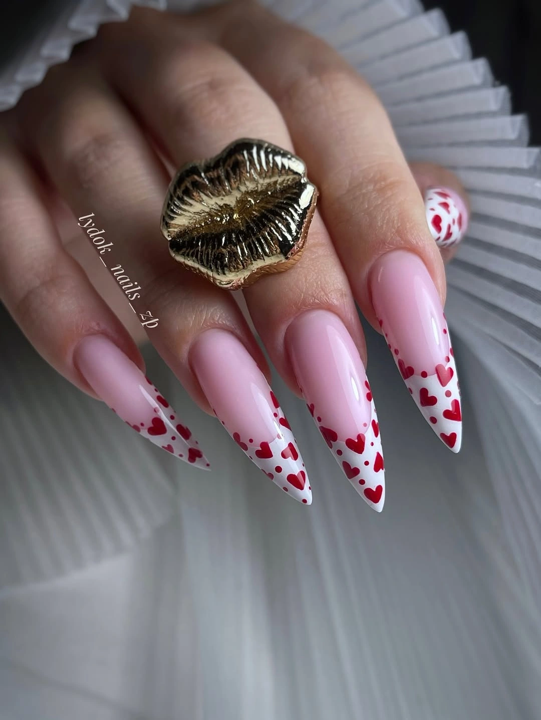 Red Heart French Tips for a Non-Christmas December Long pink pointed nails with white tips and red hearts