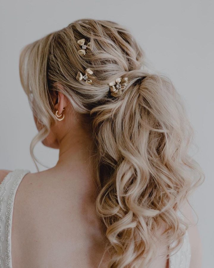 Blonde Low Ponytail With Butterfly Pins Blonde Low Ponytail With Butterfly Pins — Destination Wedding Hairstyles 2027