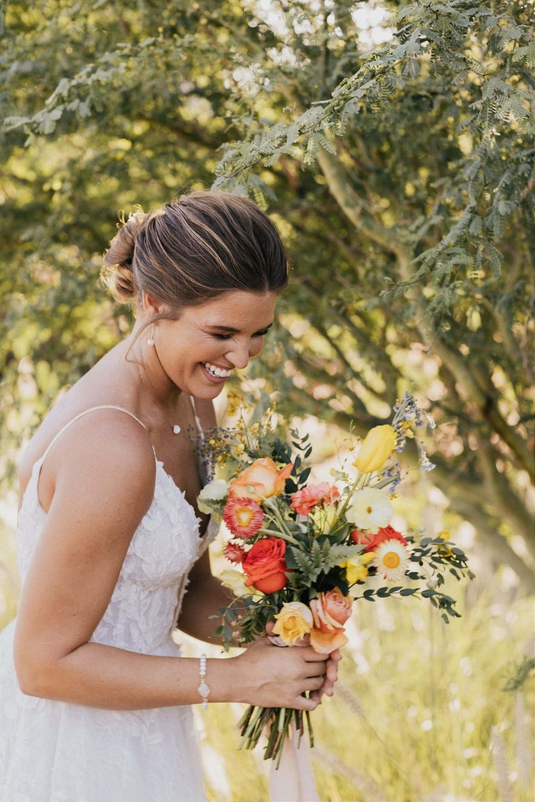 Brown Messy Bun With Loose Strands Brown Messy Bun With Loose Strands — Destination Wedding Hairstyles 2027