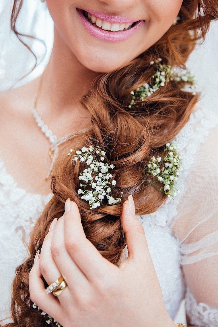 Auburn Fishtail Braid With Flowers Auburn Fishtail Braid With Flowers — Destination Wedding Hairstyles 2027