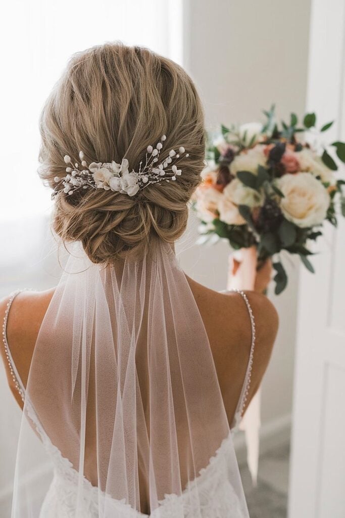 Blonde Textured Low Updo With Accessory Blonde Textured Low Updo With Accessory — Destination Wedding Hairstyles 2027