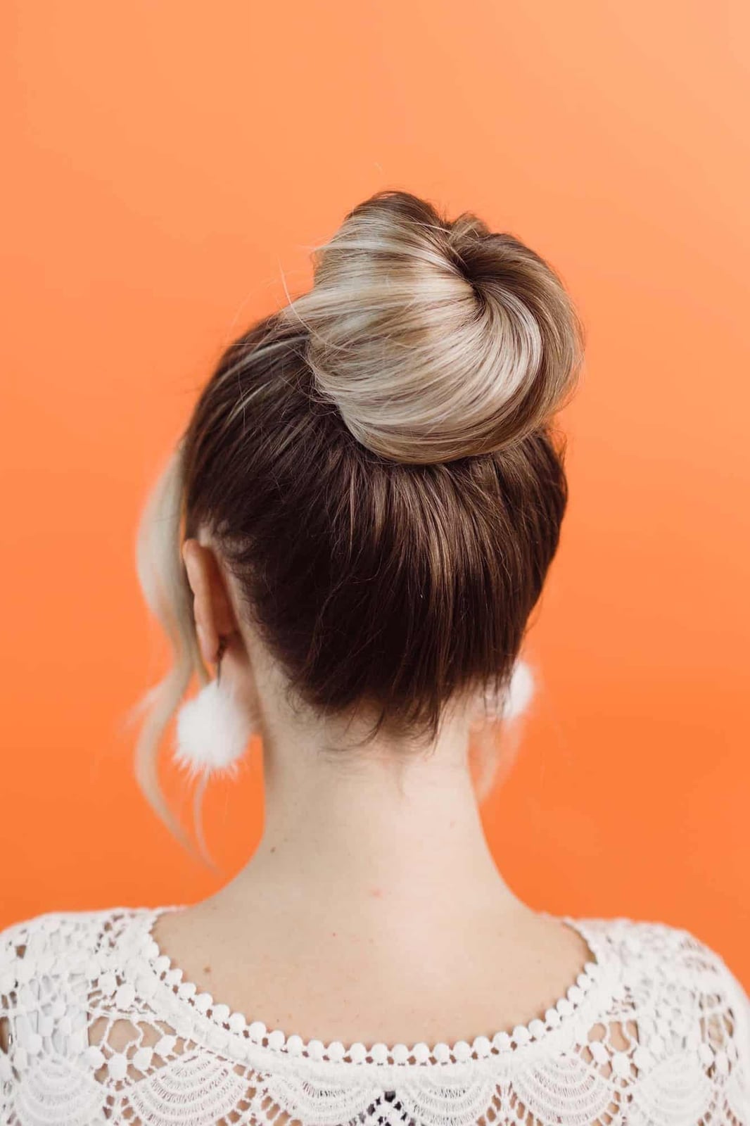 Rounded Dark Brown Donut Bun With Blonde Highlights Rounded Dark Brown Donut Bun With Blonde Highlights — Donut Bun Hairstyles 2027