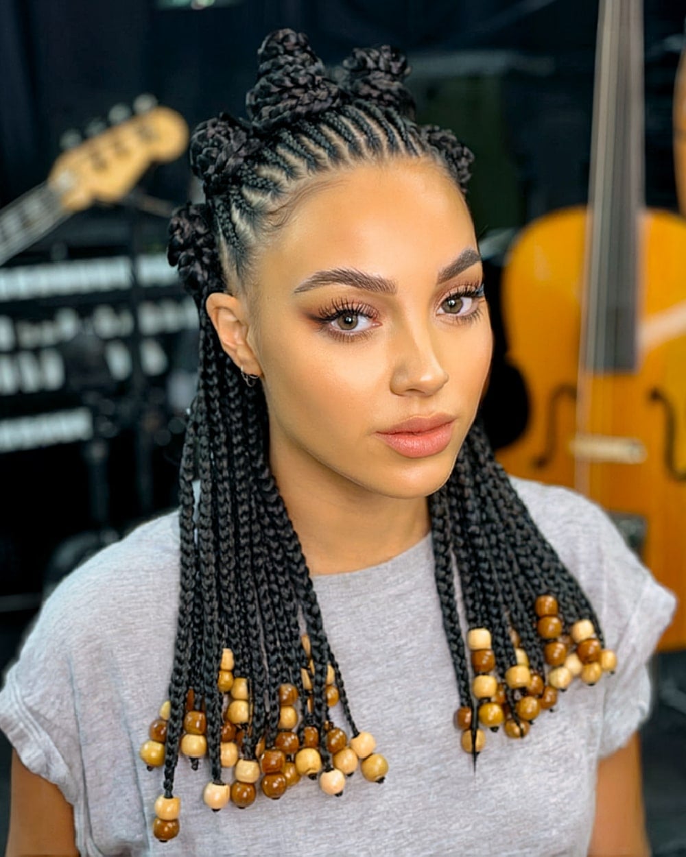 Mid-Back Black Braids With Wooden Beads Mid-Back Black Braids With Wooden Beads — Down Country Concert Hairstyles 2027
