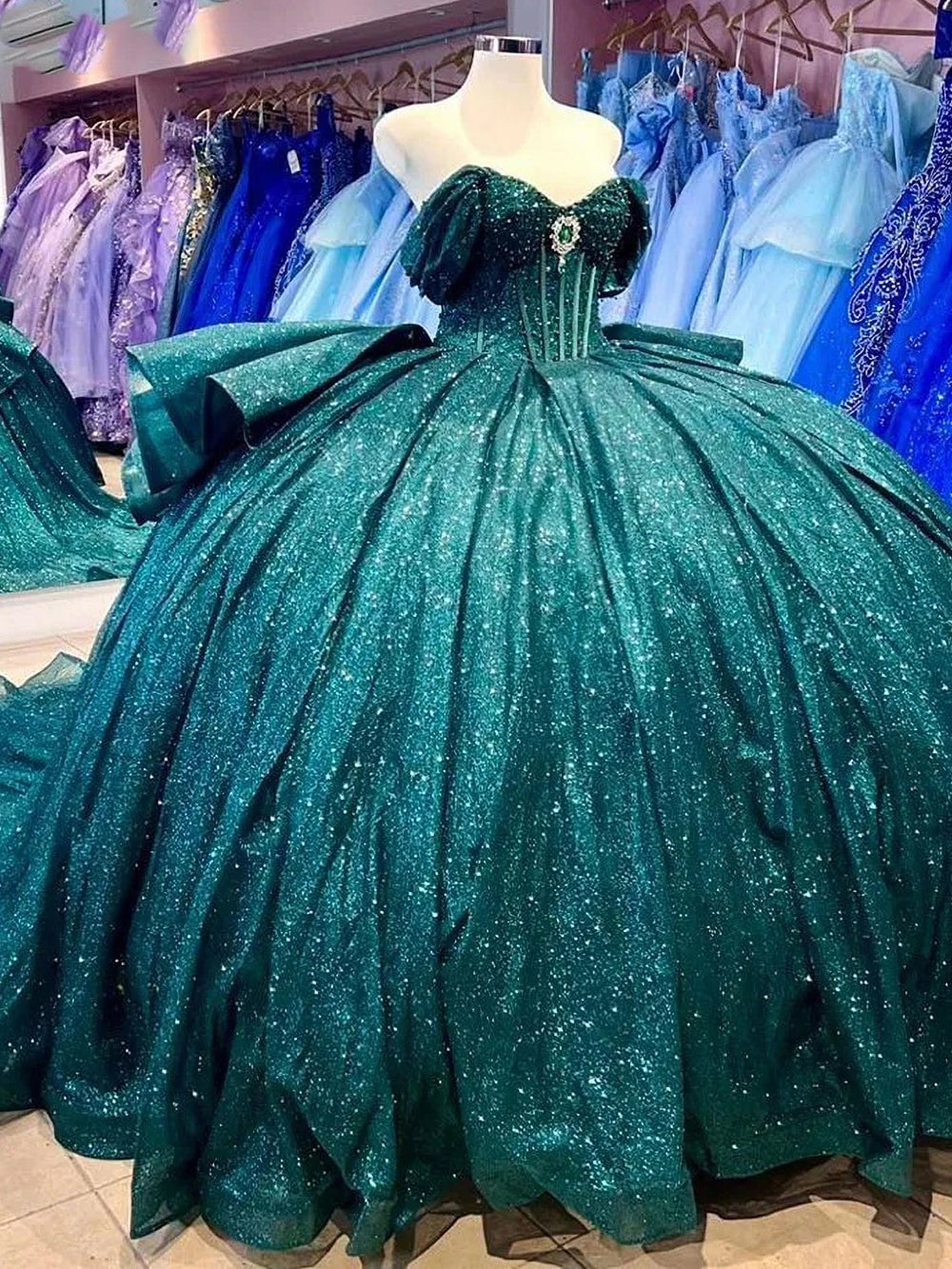 Quinceañera dress with gold glitter and embroidery, Close-Up Take Quinceañera dress with gold glitter and embroidery, Close-Up Take — Emerald Green Quinceanera Dress 2027