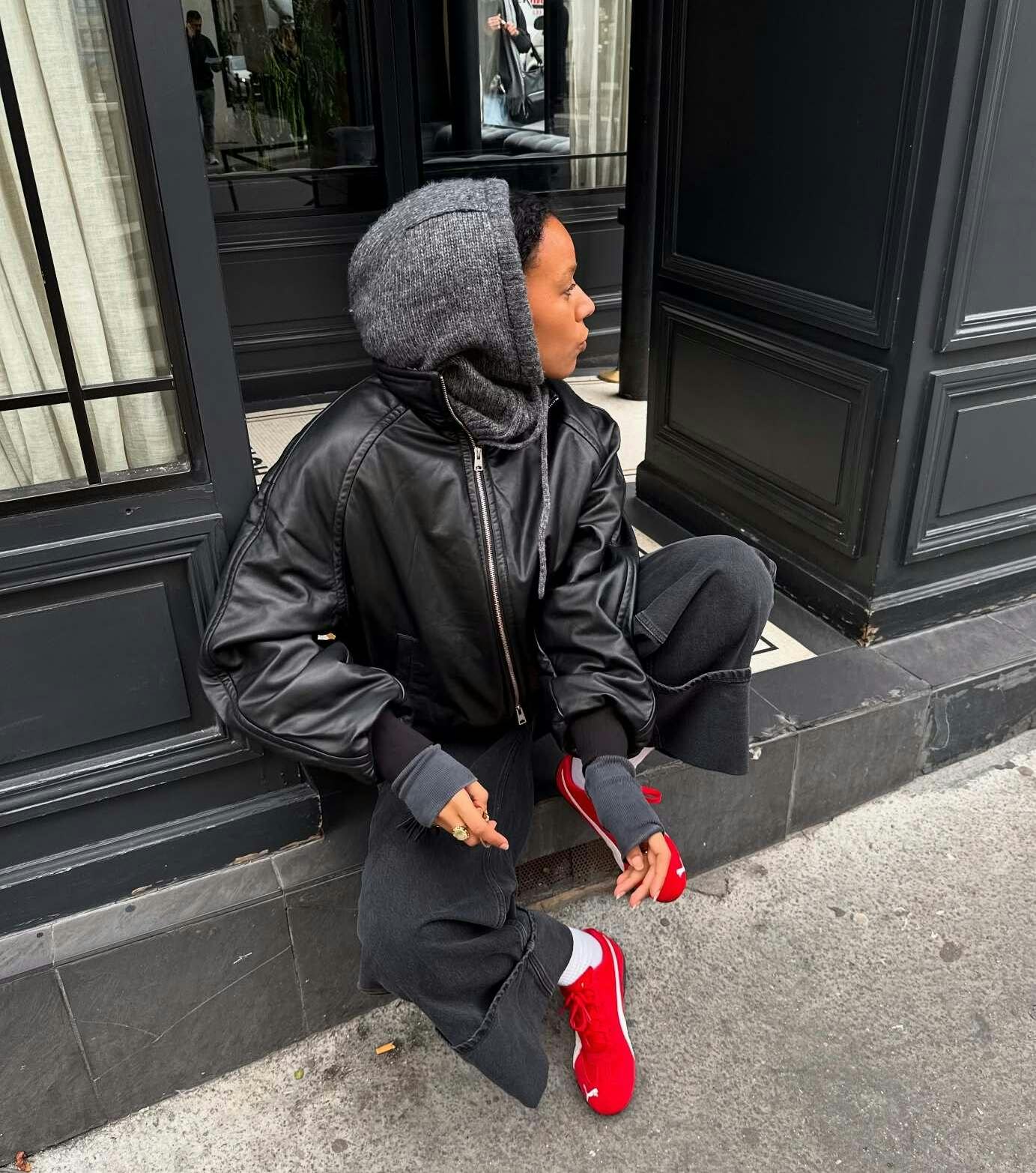 Black leather bomber jacket with red sneakers Black leather bomber jacket with red sneakers — Fall Bomber Jacket Outfits 2026