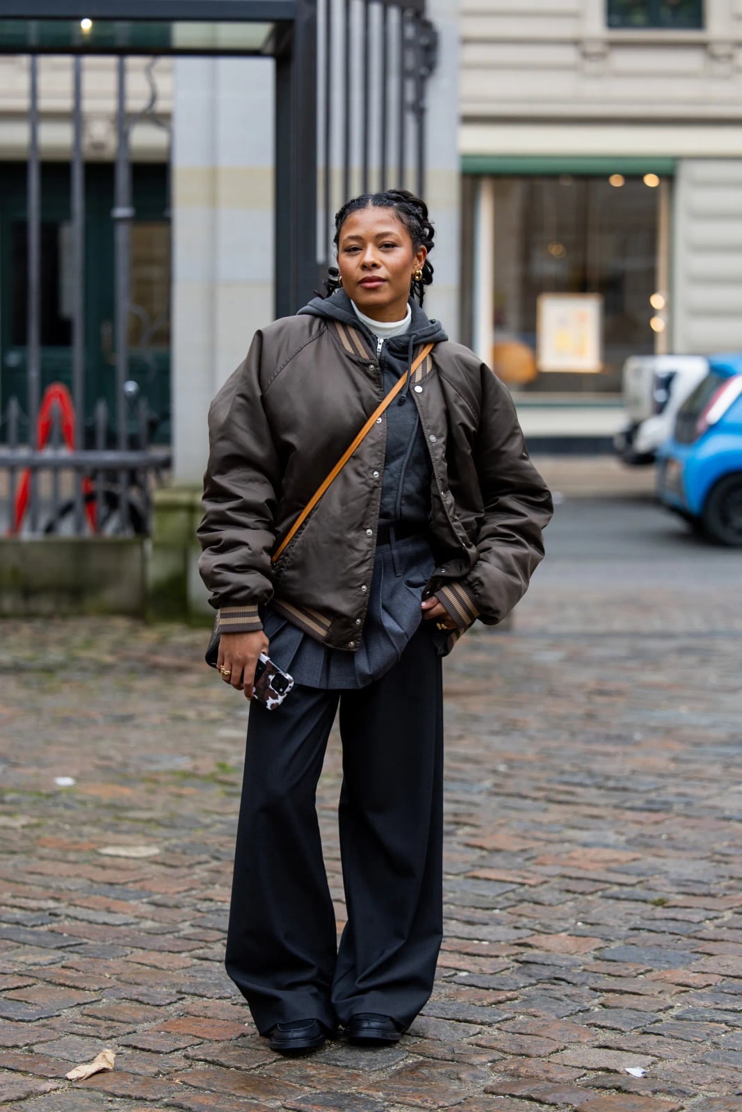 Brown bomber jacket with layered top and wide-leg pants Brown bomber jacket with layered top and wide-leg pants — Fall Bomber Jacket Outfits 2026