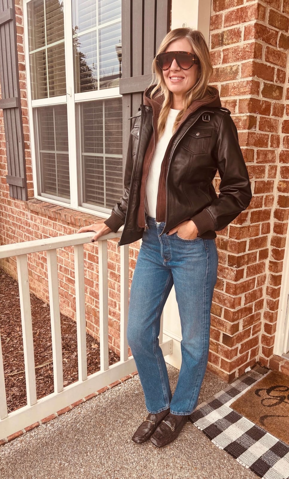 Dark brown leather bomber jacket with hooded layer Dark brown leather bomber jacket with hooded layer — Fall Bomber Jacket Outfits 2026