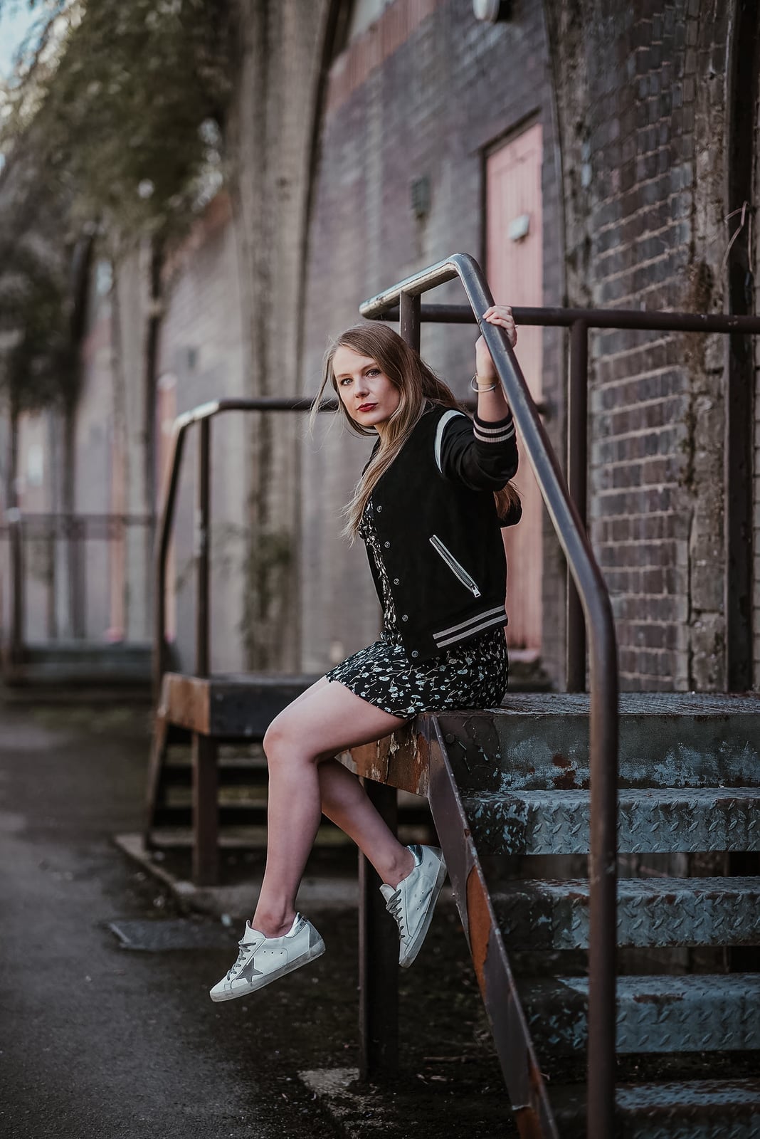 Black varsity bomber jacket with floral print dress Black varsity bomber jacket with floral print dress — Fall Bomber Jacket Outfits 2026