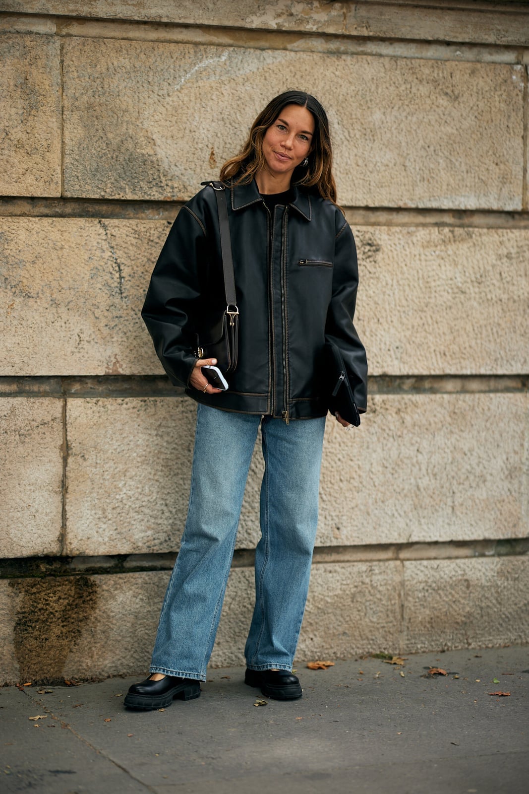 Oversized black leather bomber jacket with straight-leg, Close-Up Take Oversized black leather bomber jacket with straight-leg, Close-Up Take — Fall Bomber Jacket Outfits 2026