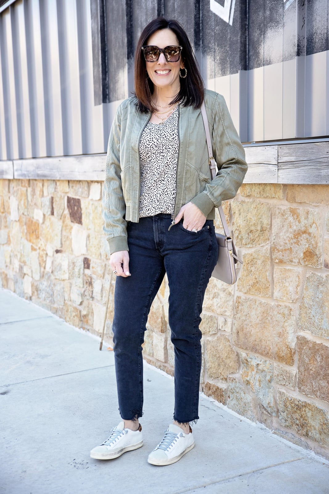 Olive green bomber jacket with patterned top and straight-leg jeans Olive green bomber jacket with patterned top and straight-leg jeans — Fall Bomber Jacket Outfits 2026