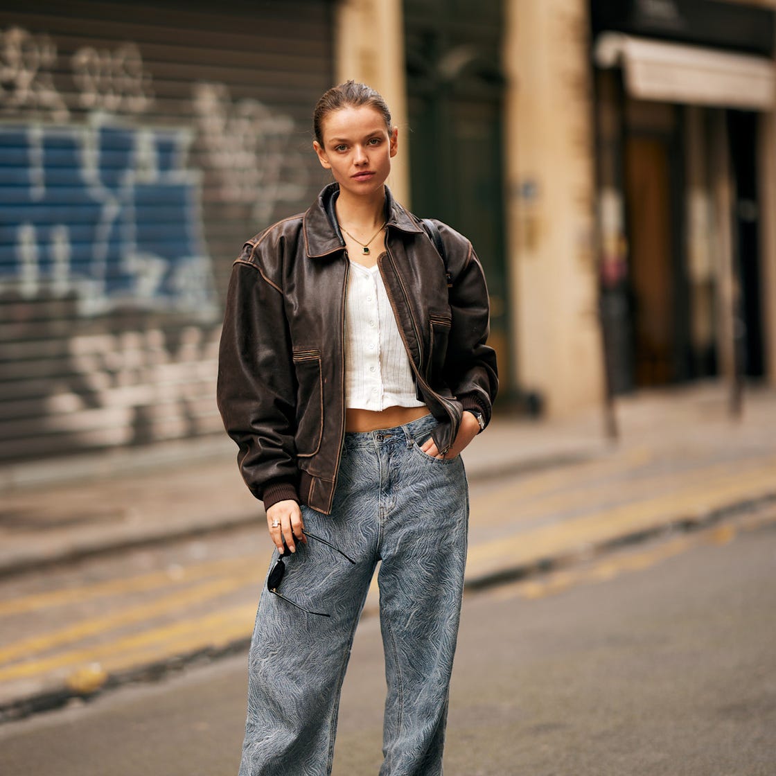 Brown leather bomber jacket with patterned jeans Brown leather bomber jacket with patterned jeans — Fall Bomber Jacket Outfits 2026