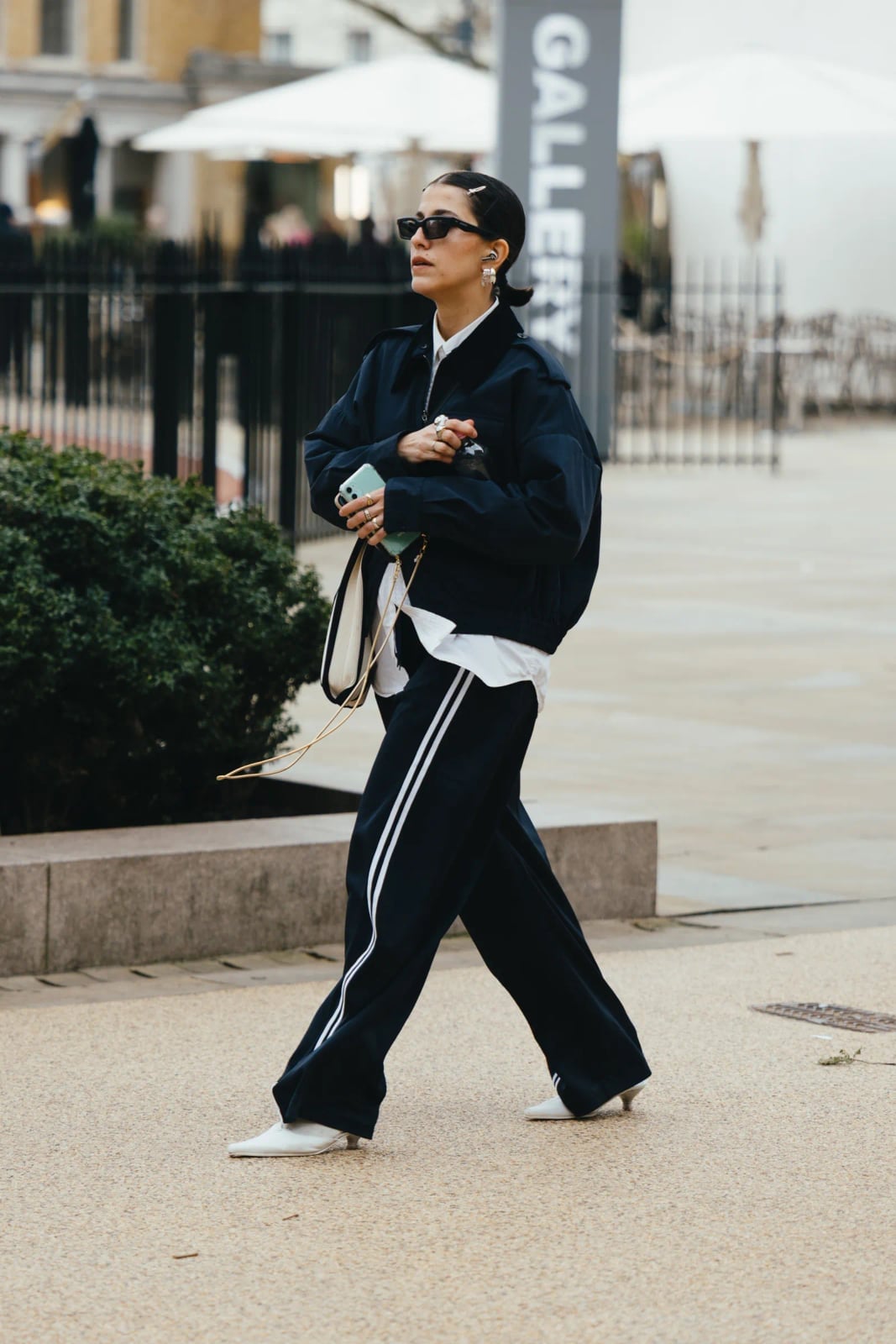 Navy oversized bomber jacket with striped track pants Navy oversized bomber jacket with striped track pants — Fall Bomber Jacket Outfits 2026