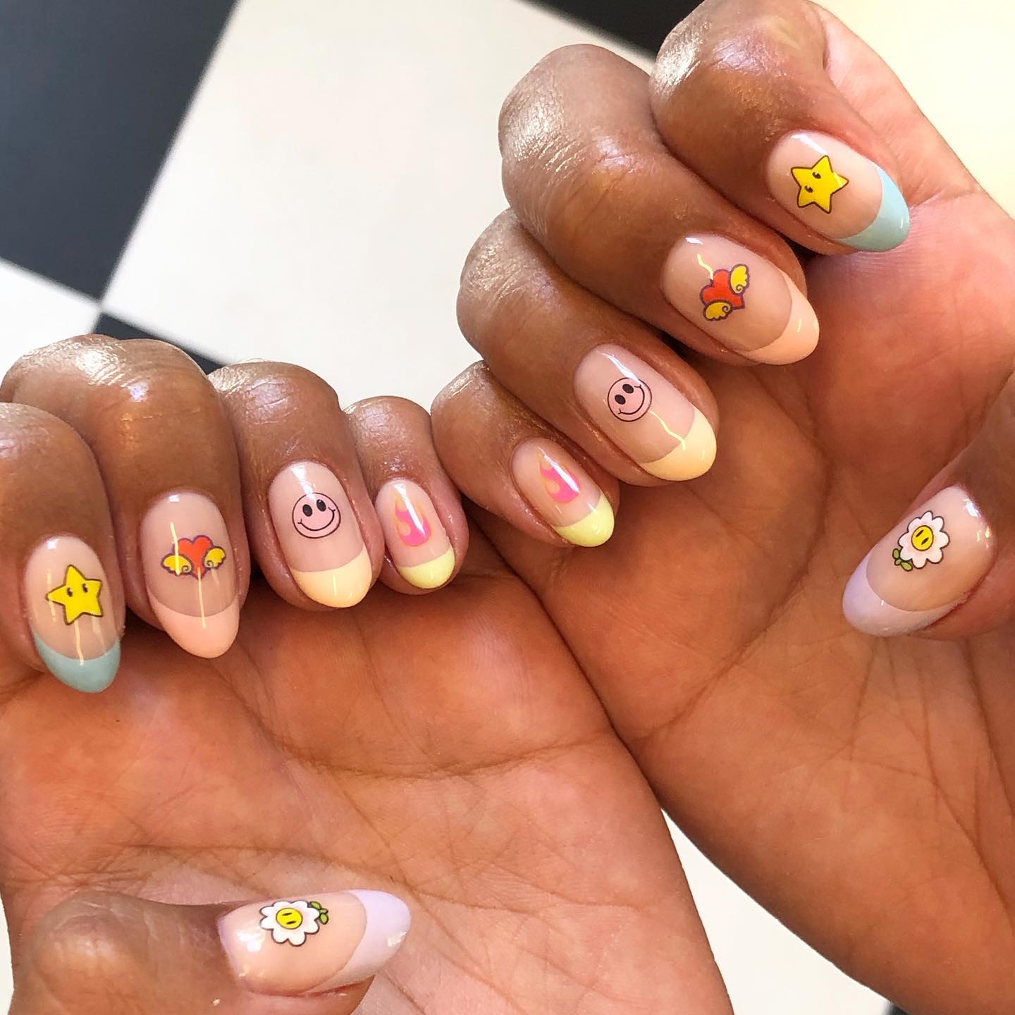 Short Oval Pastel French Tips With Cartoon Motifs Short Oval Pastel French Tips With Cartoon Motifs — French Smiley Face Nails 2027