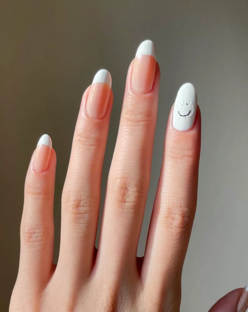 Almond French With Black Smiley Accent Nail Almond French With Black Smiley Accent Nail — French Smiley Face Nails 2027