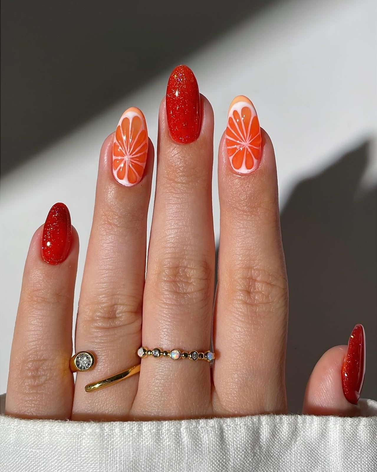 Medium Almond Orange Slice Glitter Nails, Close-Up Take Medium Almond Orange Slice Glitter Nails, Close-Up Take — Fruit Nails 2027