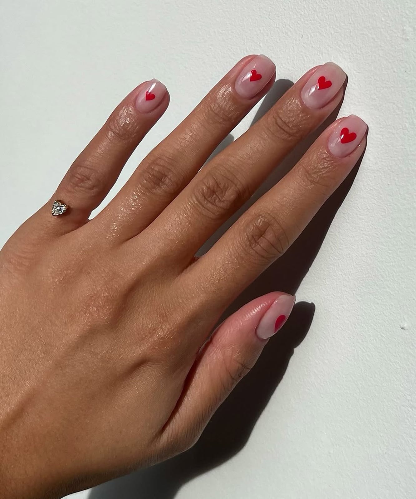 Short Almond Nude with Delicate Red Hearts Short Almond Nude with Delicate Red Hearts — Galentines Nails 2027