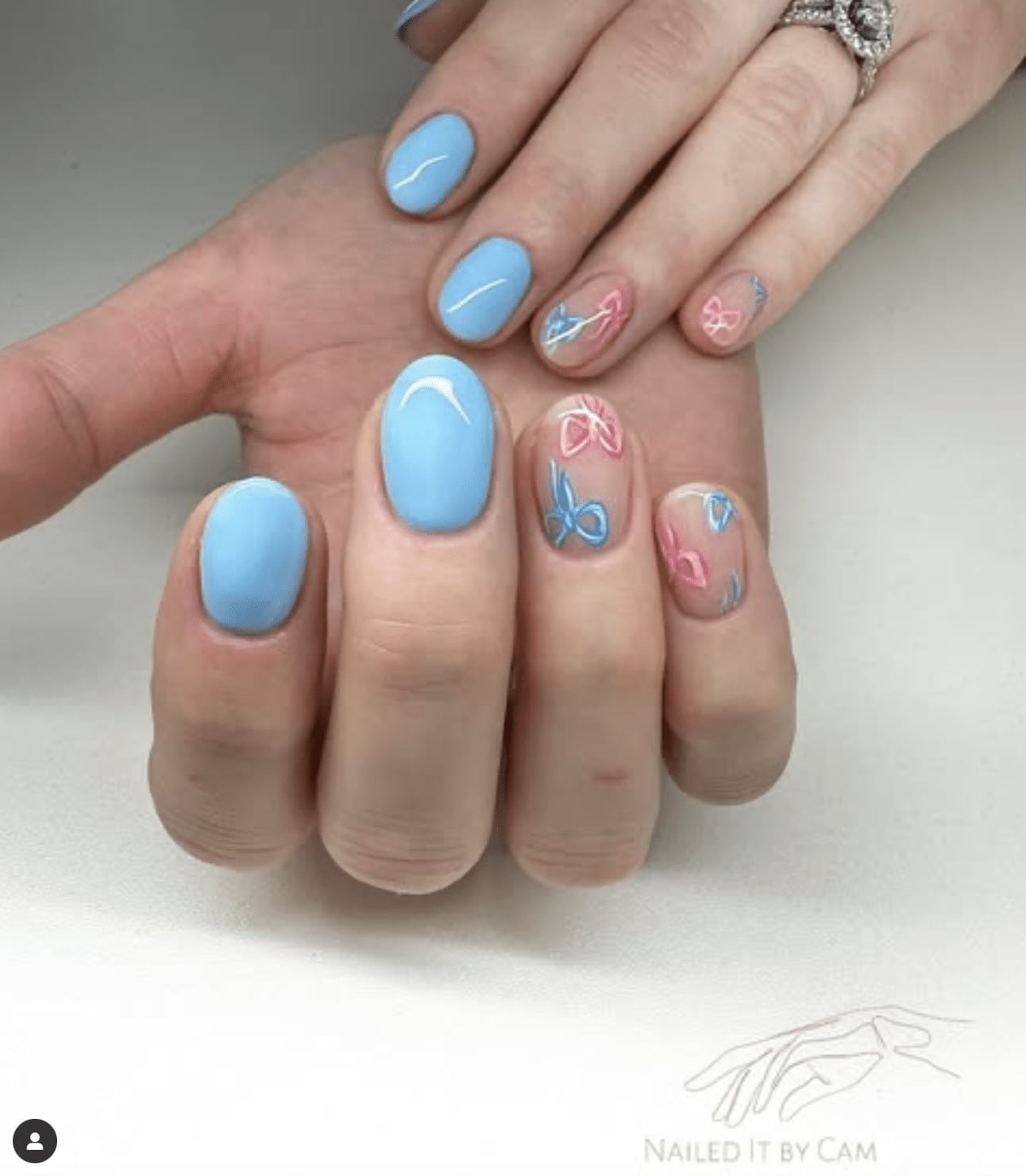 Short Oval Nails with Pink and Blue Bow Accents — Gender Reveal Nails 2027