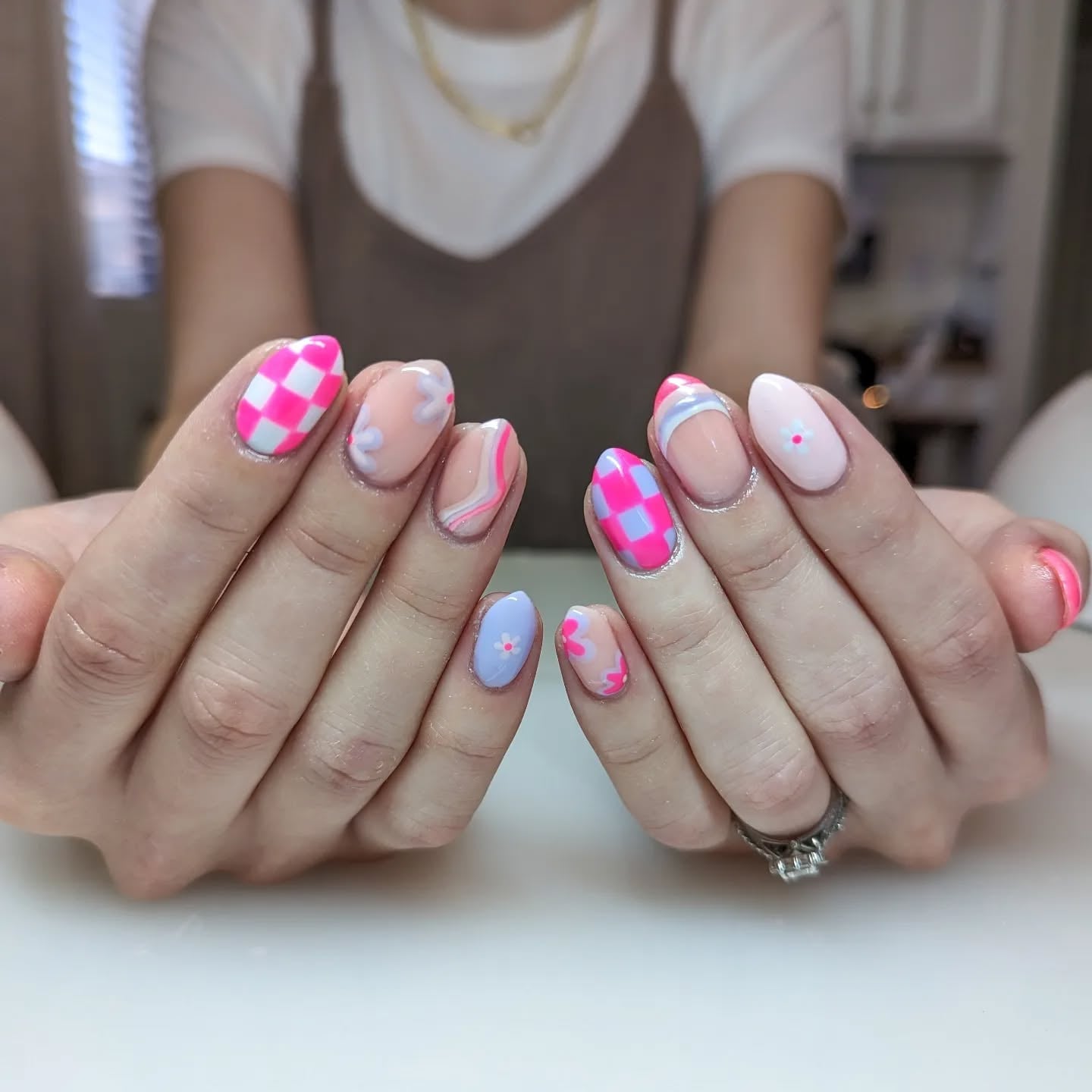 Medium Almond Nails with Checkered and Floral Accents — Gender Reveal Nails 2027