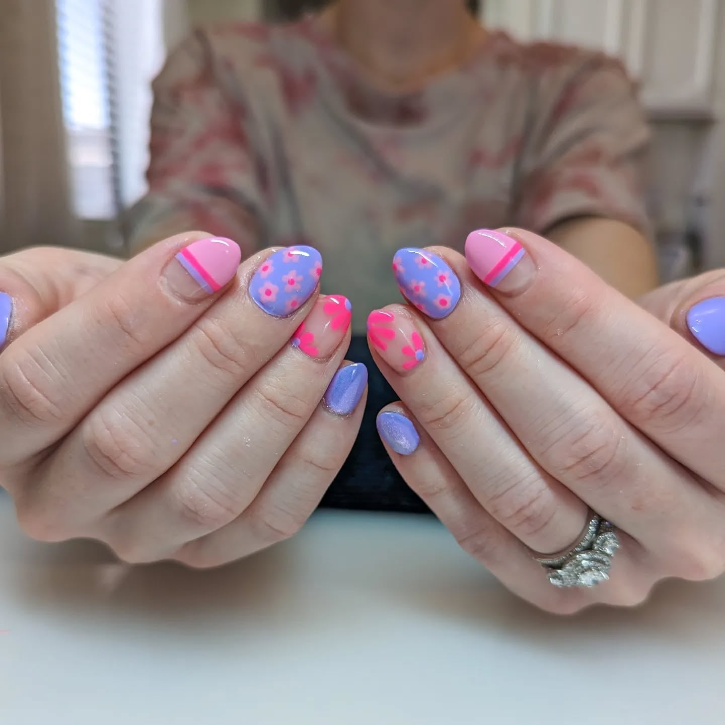 Medium Oval Nails with Floral and Stripe Designs — Gender Reveal Nails 2027