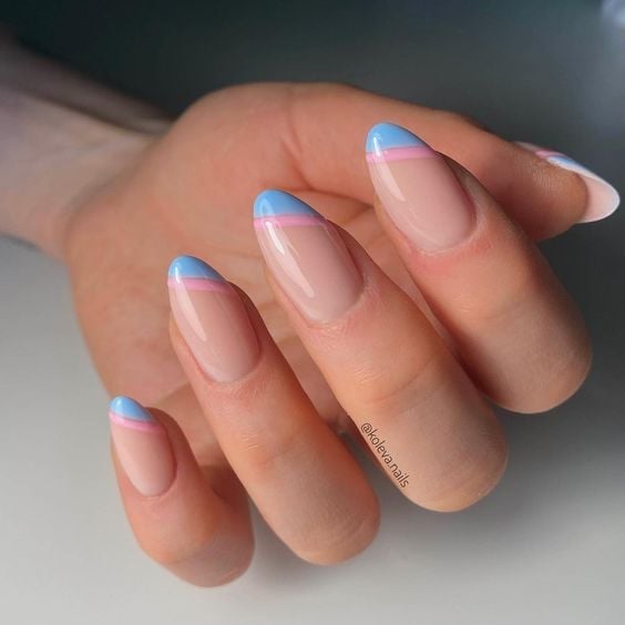 Nude Almond French Tips with Pastel Accents — Gender Reveal Nails 2027