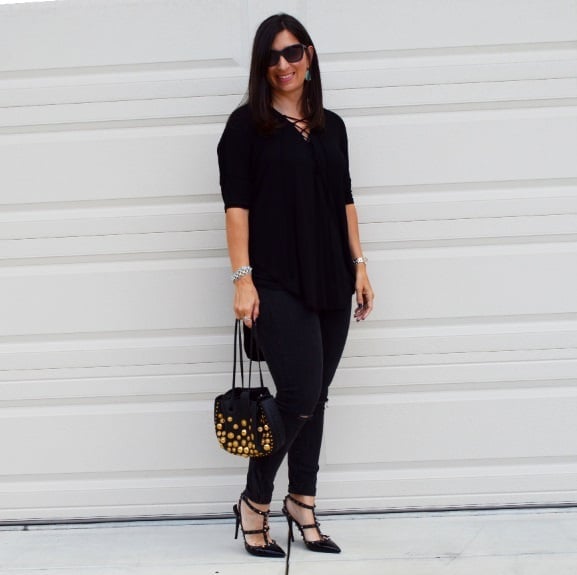 Black lace-up top with ripped skinny jeans — Girls Night Out Outfits 2027