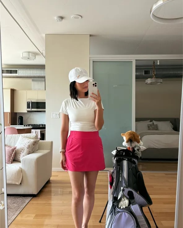 White t-shirt with bright pink skort White t-shirt with bright pink skort — Golf Tournament Outfits 2027