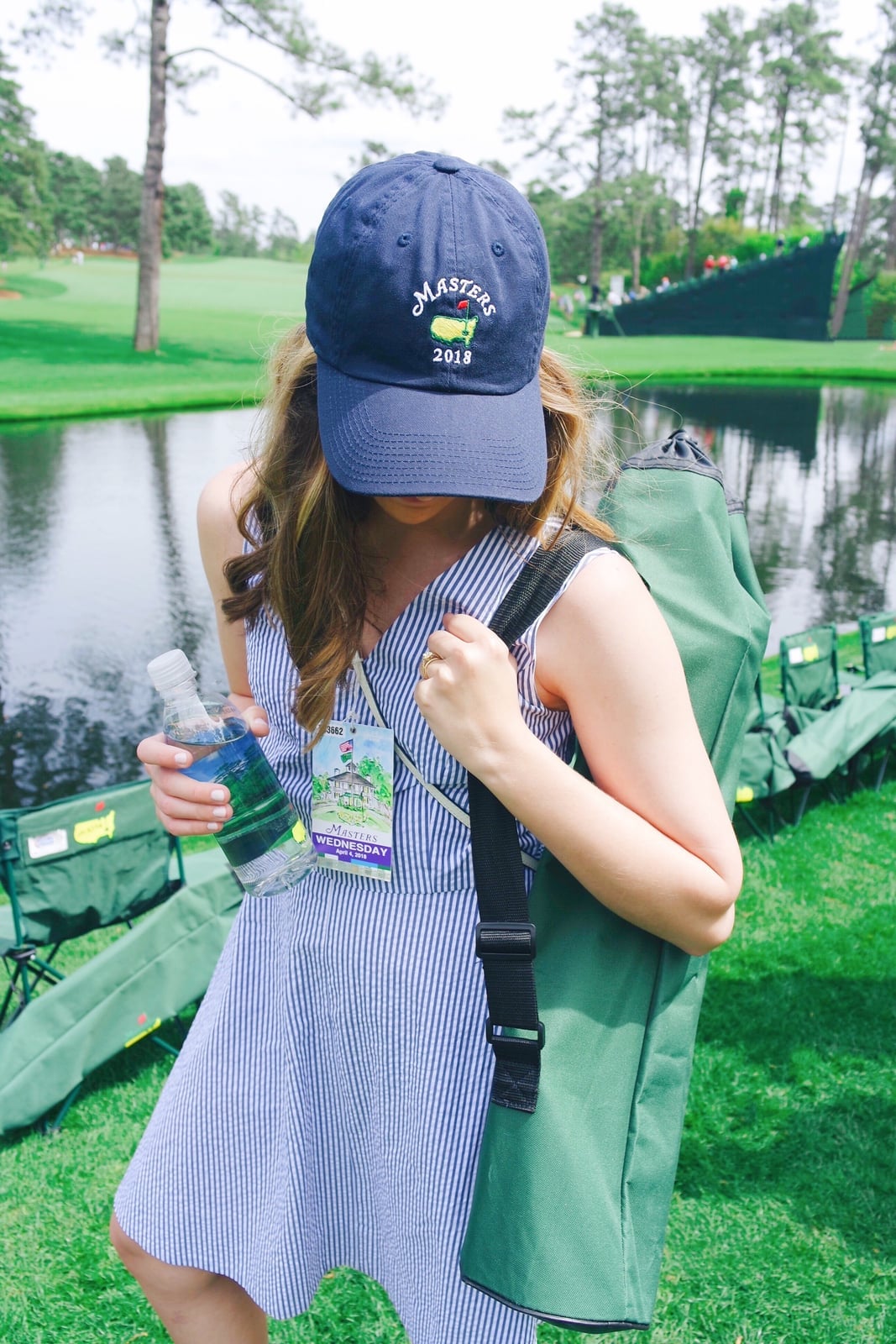 Striped seersucker dress with navy jacket Striped seersucker dress with navy jacket — Golf Tournament Outfits 2027