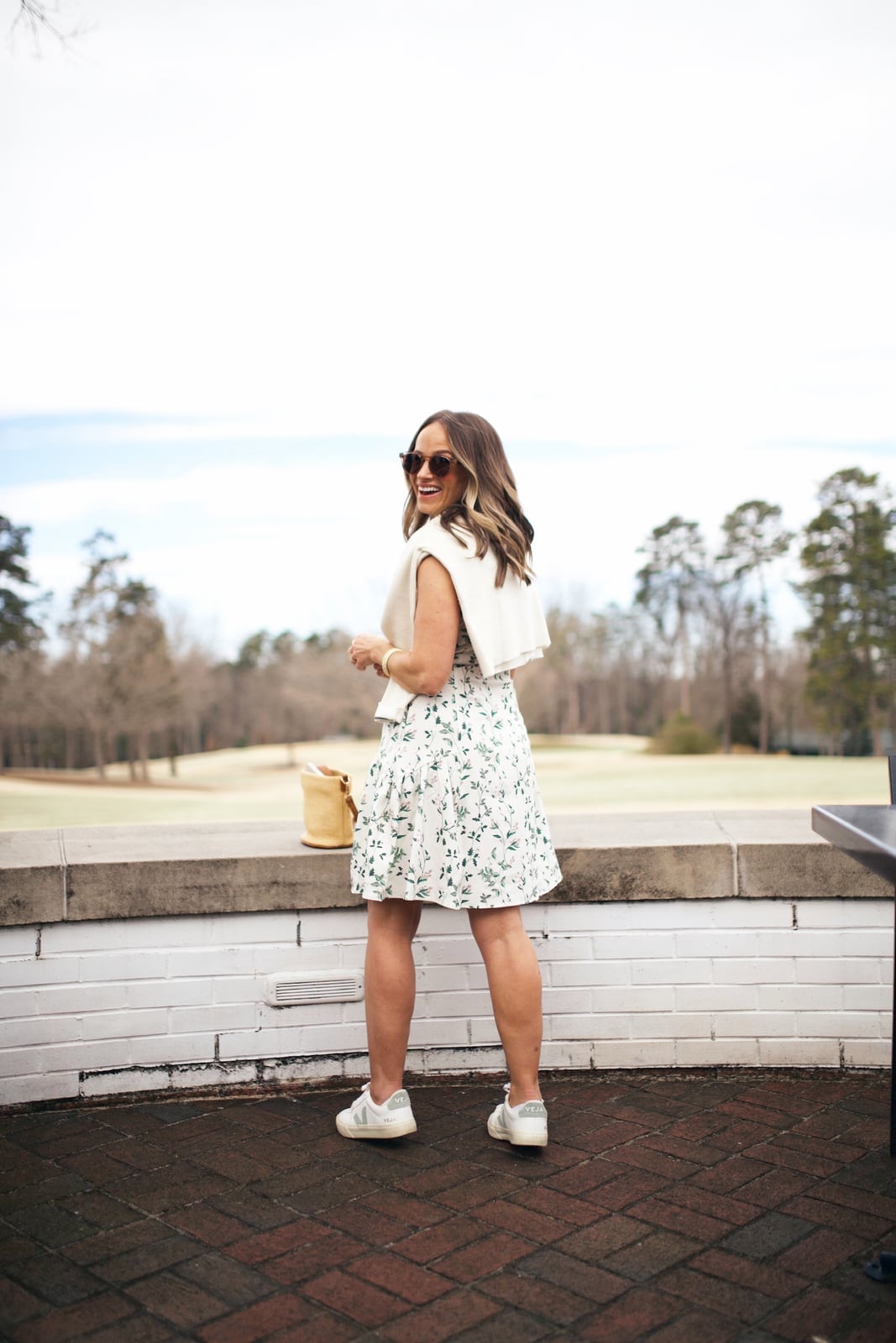 White cropped sweater with floral skirt White cropped sweater with floral skirt — Golf Tournament Outfits 2027