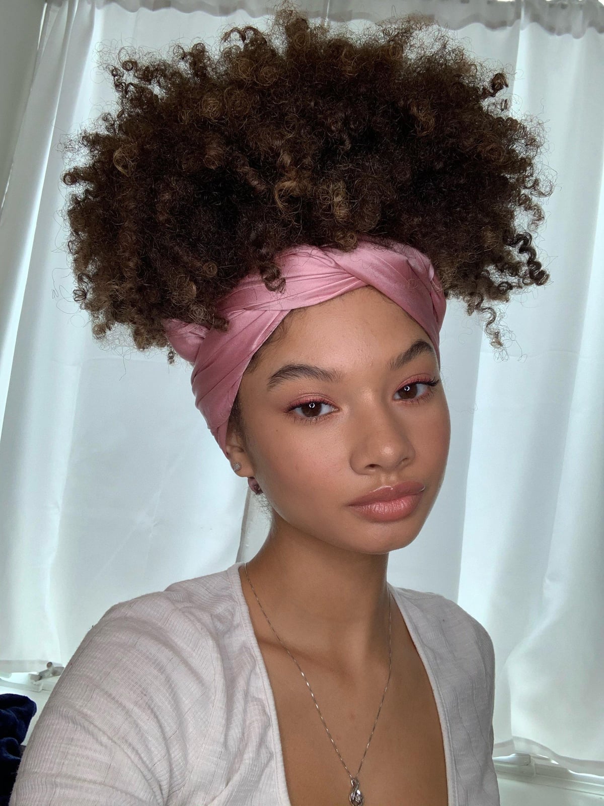 Voluminous Curly Hair With Pink Head Wrap Voluminous Curly Hair With Pink Head Wrap — Head Wrap Hairstyles 2027