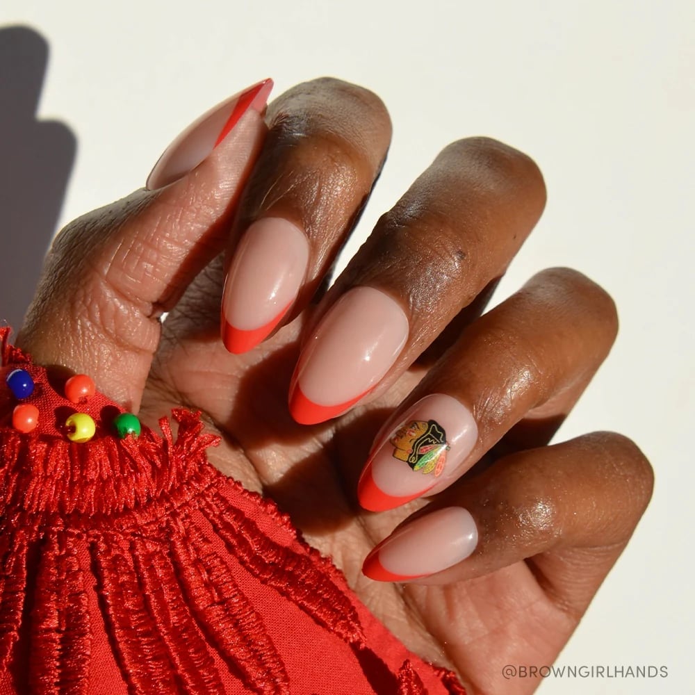 Nude Orange French Tip Almond Nails With Logo, Close-Up Take Nude Orange French Tip Almond Nails With Logo, Close-Up Take — Hockey Nails 2027