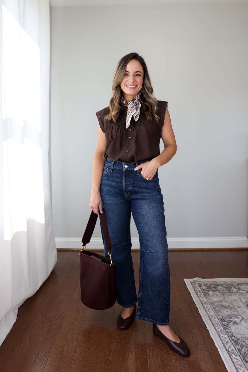 Dark wash wide leg jeans with a brown ruffled sleeveless blouse Dark wash wide leg jeans with a brown ruffled sleeveless blouse — Jeans Outfits 2027 with Blouse
