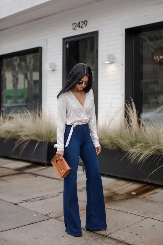 Dark wash wide flare jeans with a white satin wrap blouse Dark wash wide flare jeans with a white satin wrap blouse — Jeans Outfits 2027 with Blouse